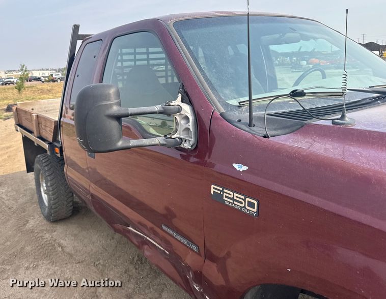 image for item ER2260 2000 Ford F250 Super Duty SuperCab flatbed pickup truck