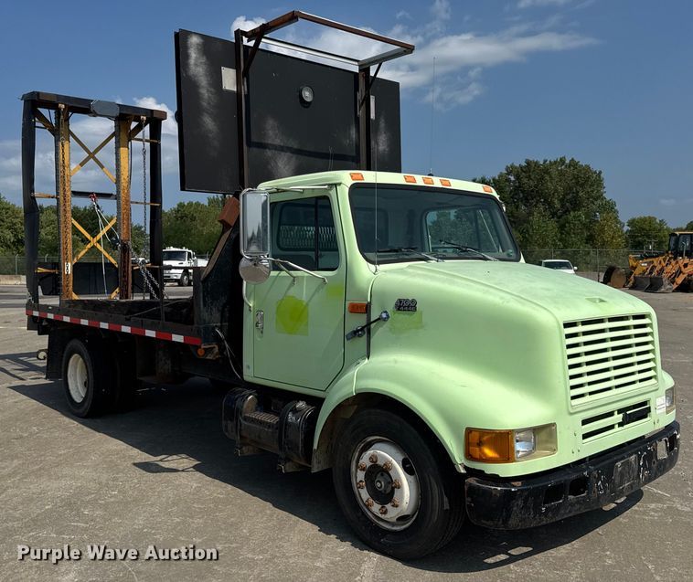 image for item DW6504 1999 International 4700  flatbed truck with crash attenuator