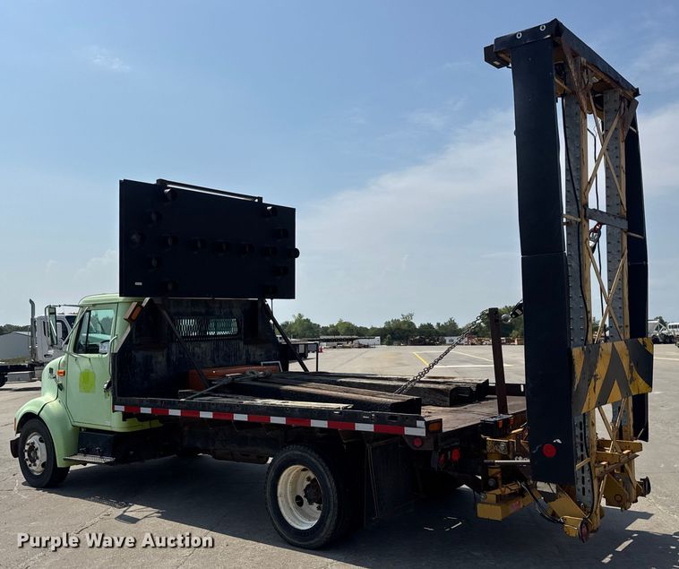 image for item DW6504 1999 International 4700  flatbed truck with crash attenuator