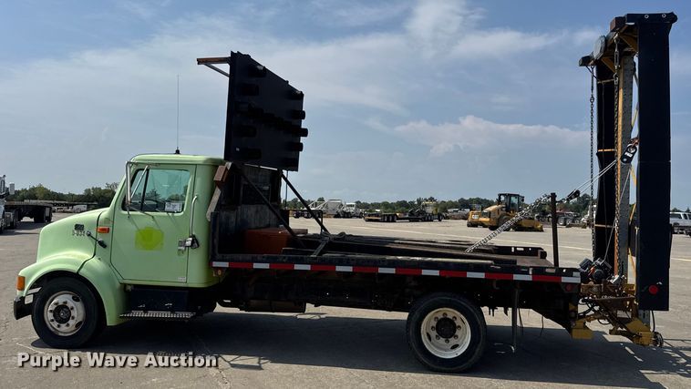 image for item DW6504 1999 International 4700  flatbed truck with crash attenuator