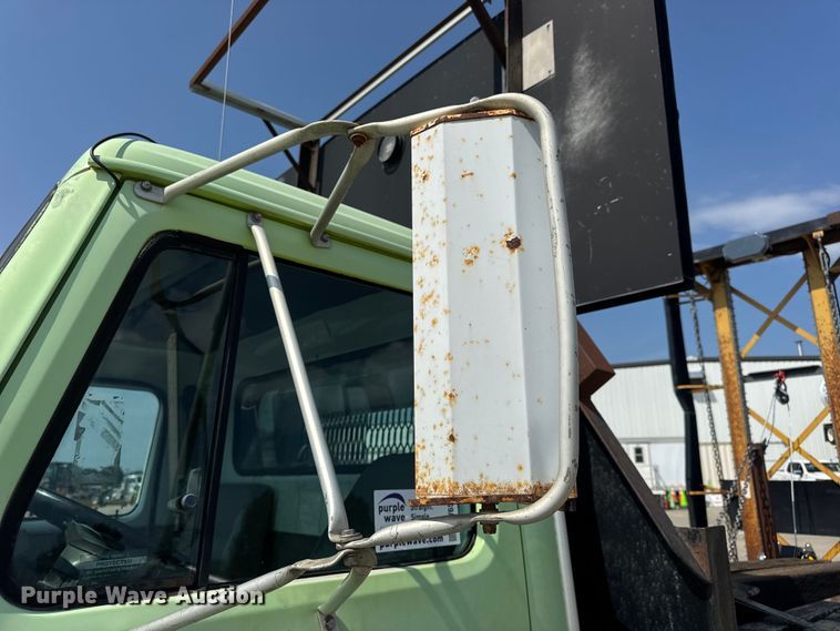 image for item DW6504 1999 International 4700  flatbed truck with crash attenuator