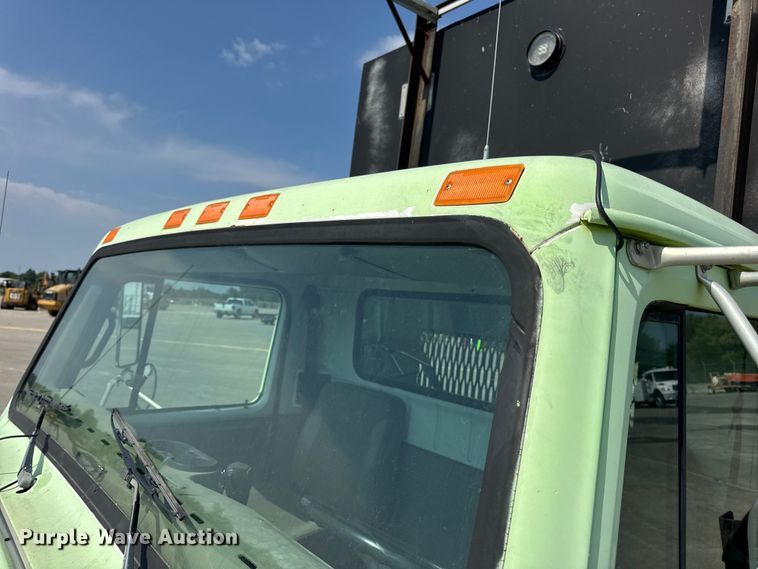 image for item DW6504 1999 International 4700  flatbed truck with crash attenuator