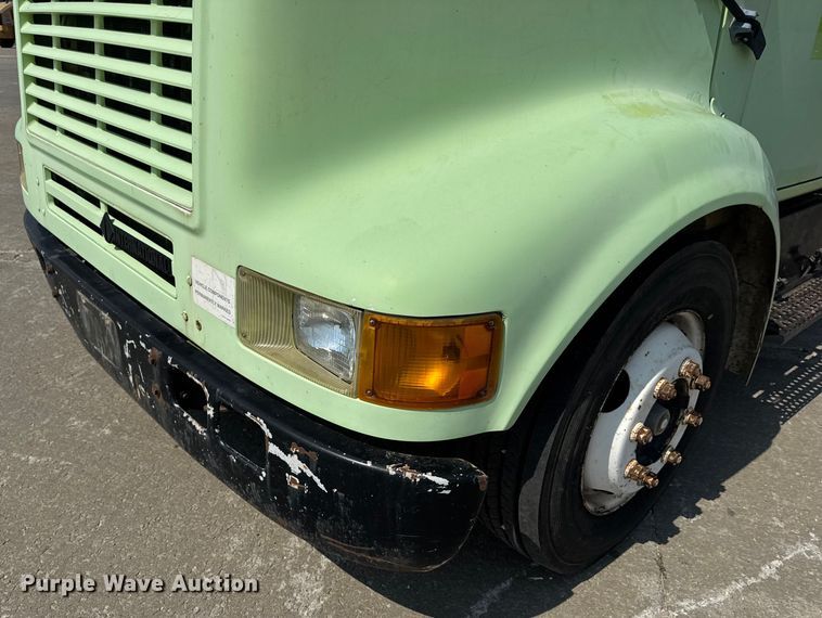 image for item DW6504 1999 International 4700  flatbed truck with crash attenuator