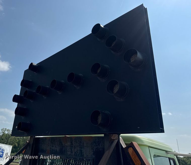 image for item DW6504 1999 International 4700  flatbed truck with crash attenuator