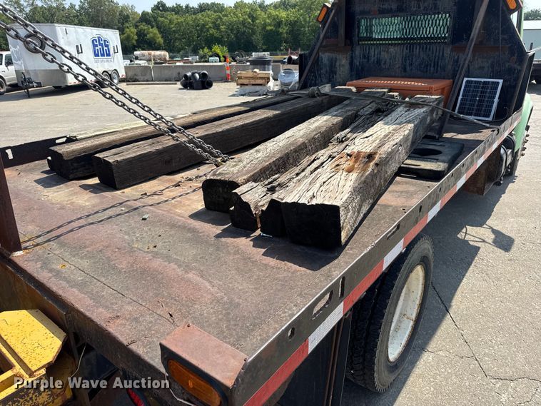 image for item DW6504 1999 International 4700  flatbed truck with crash attenuator