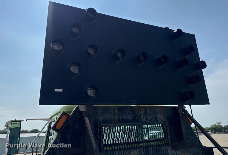 image for item DW6504 1999 International 4700  flatbed truck with crash attenuator