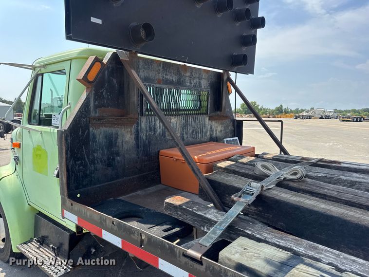 image for item DW6504 1999 International 4700  flatbed truck with crash attenuator