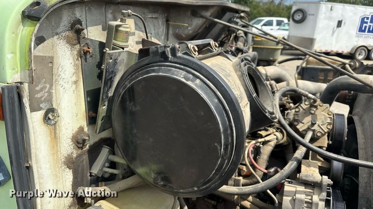 image for item DW6504 1999 International 4700  flatbed truck with crash attenuator