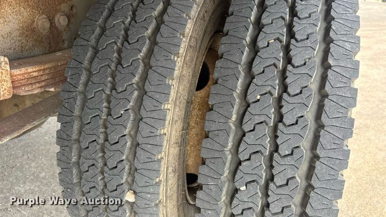 image for item DW6504 1999 International 4700  flatbed truck with crash attenuator