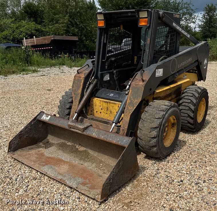 MINI CARGADOR SOBRE RUEDAS 2003 NEW HOLLAND LS180
