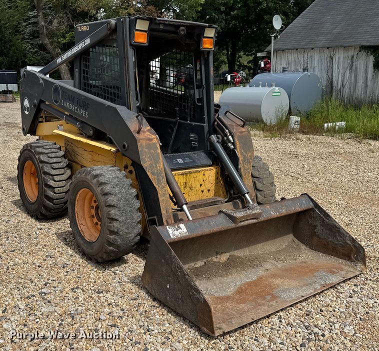 MINI CARGADOR SOBRE RUEDAS 2003 NEW HOLLAND LS180