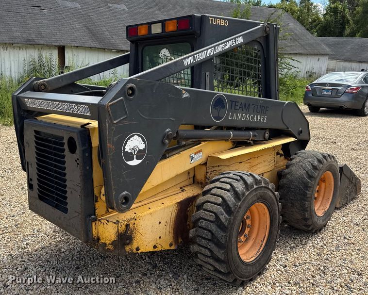 MINI CARGADOR SOBRE RUEDAS 2003 NEW HOLLAND LS180