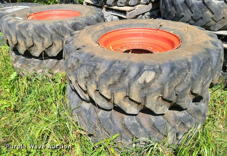 image for item DZ6572 (4) 14-24 tires and wheels
