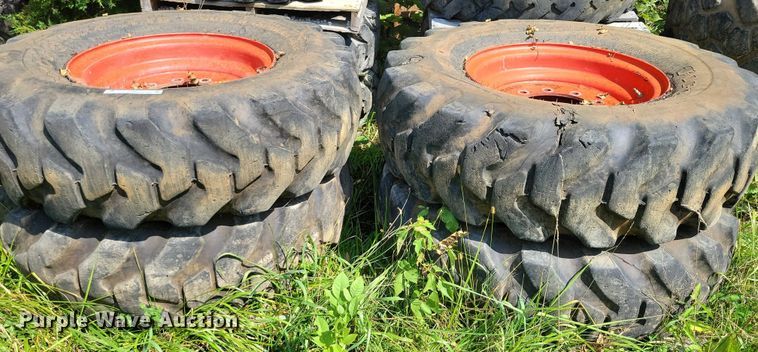 image for item DZ6572 (4) 14-24 tires and wheels