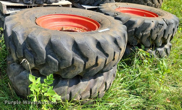 image for item DZ6572 (4) 14-24 tires and wheels