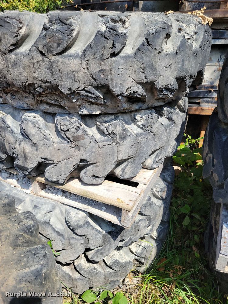 image for item DZ6573 (4) 14-24 tires and wheels