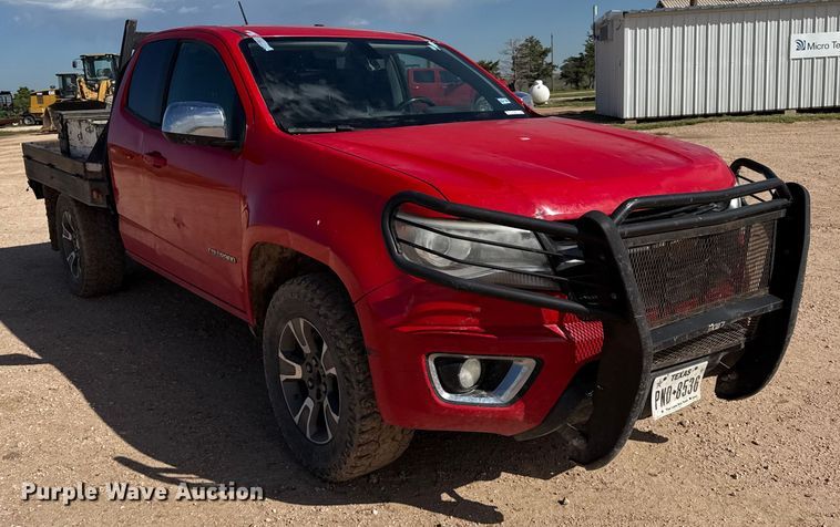 image for item EP0571 2015 Chevrolet Colorado Ext. Cab flatbed pickup truck