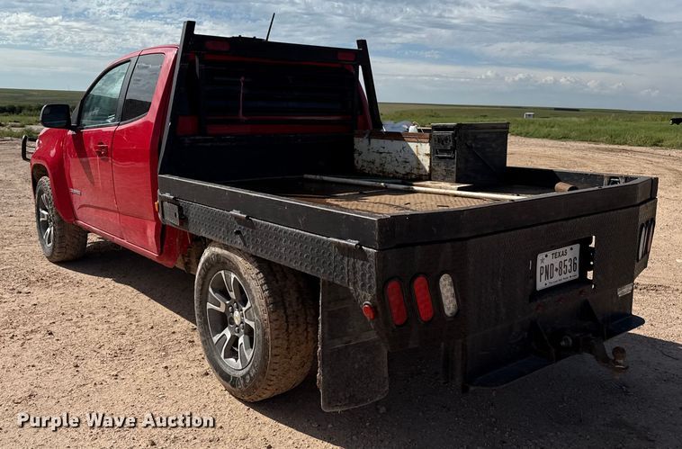 image for item EP0571 2015 Chevrolet Colorado Ext. Cab flatbed pickup truck