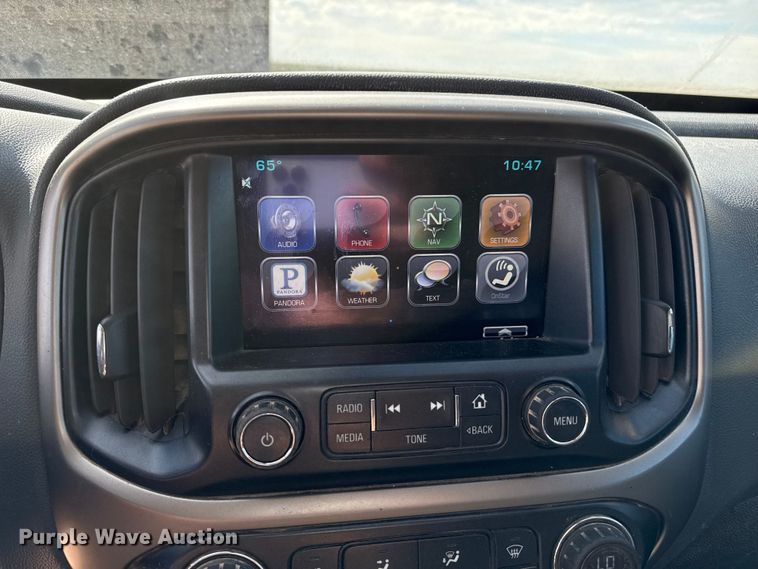 image for item EP0571 2015 Chevrolet Colorado Ext. Cab flatbed pickup truck