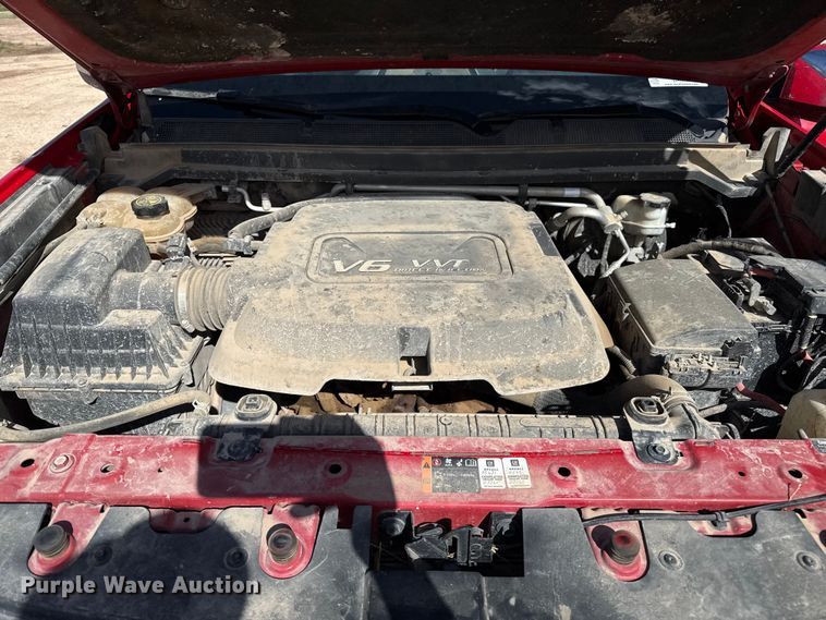 image for item EP0571 2015 Chevrolet Colorado Ext. Cab flatbed pickup truck