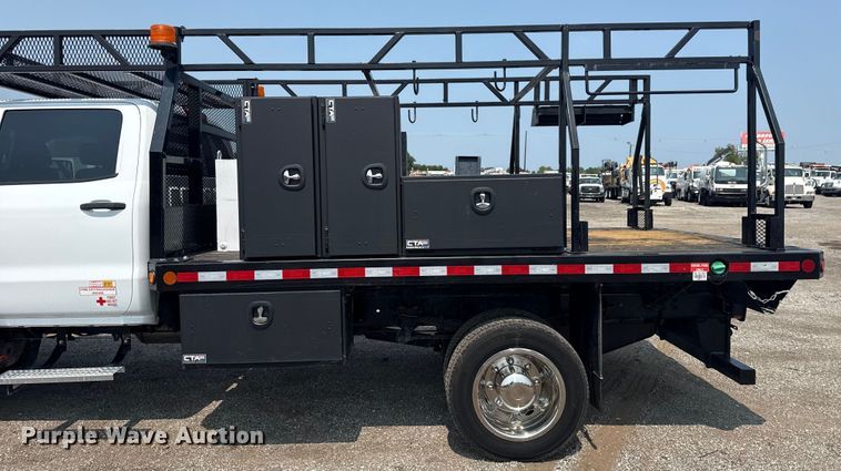 image for item NU9592 2022 Chevrolet Silverado 5500HD Crew Cab flatbed truck