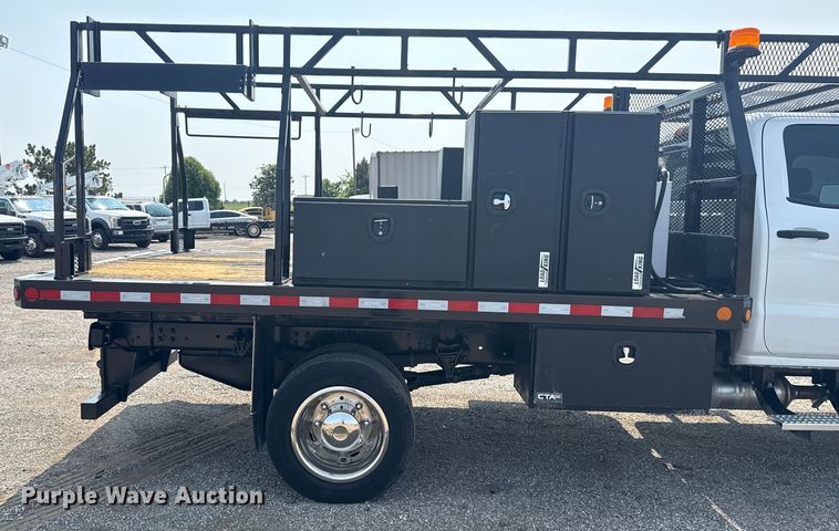 image for item NU9592 2022 Chevrolet Silverado 5500HD Crew Cab flatbed truck