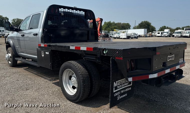 image for item NU9594 2022 RAM 5500 Crew Cab flatbed truck
