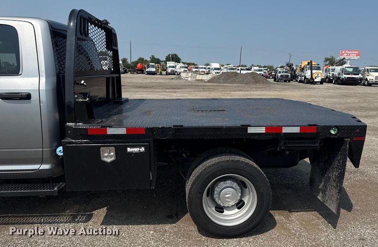 image for item NU9594 2022 RAM 5500 Crew Cab flatbed truck