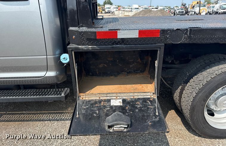 image for item NU9594 2022 RAM 5500 Crew Cab flatbed truck