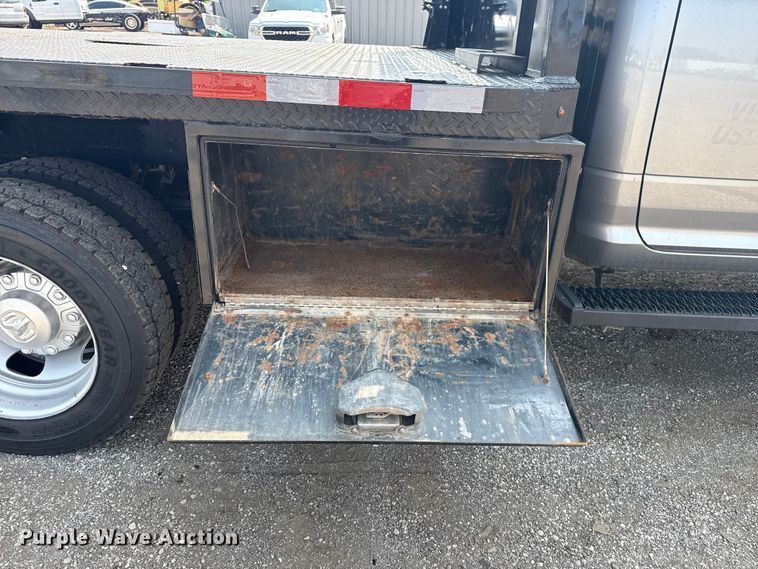 image for item NU9594 2022 RAM 5500 Crew Cab flatbed truck