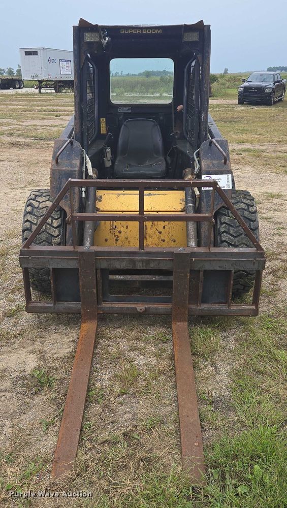 MINI CARGADOR SOBRE RUEDAS 1997 NEW HOLLAND LX665