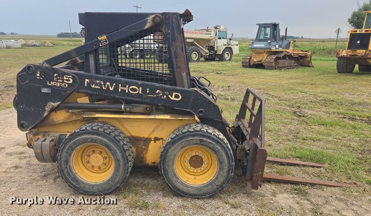 MINI CARGADOR SOBRE RUEDAS 1997 NEW HOLLAND LX665