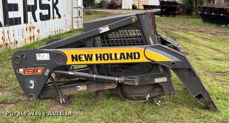 image for item EE3972 New Holland L 190 skid steer cab and loader arms