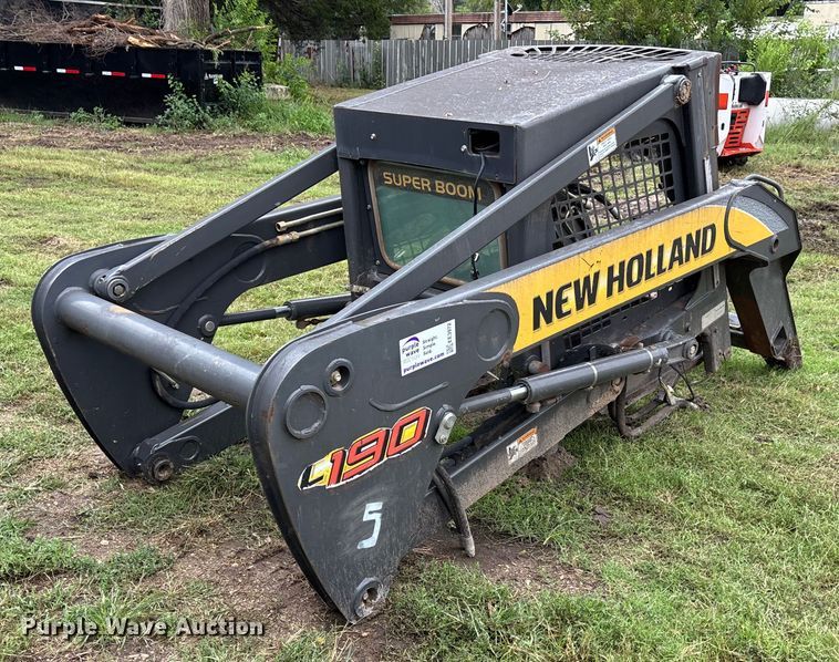 image for item EE3972 New Holland L 190 skid steer cab and loader arms