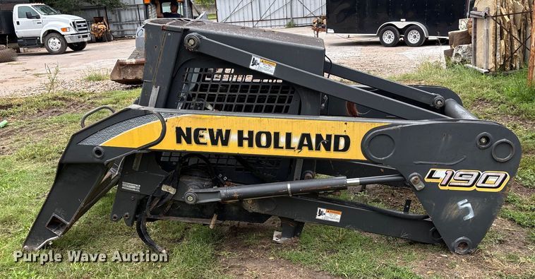 image for item EE3972 New Holland L 190 skid steer cab and loader arms