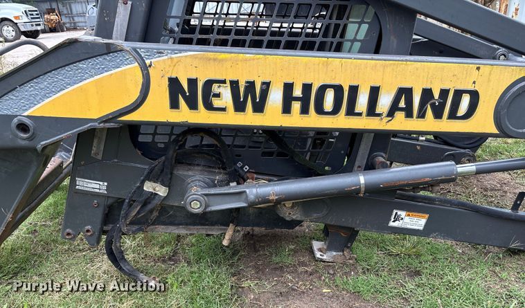 image for item EE3972 New Holland L 190 skid steer cab and loader arms