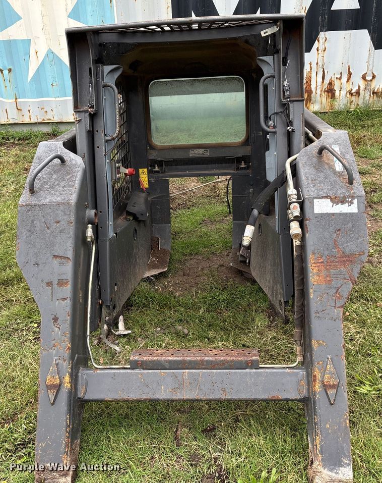 image for item EE3972 New Holland L 190 skid steer cab and loader arms