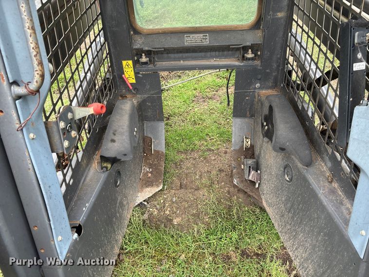 image for item EE3972 New Holland L 190 skid steer cab and loader arms