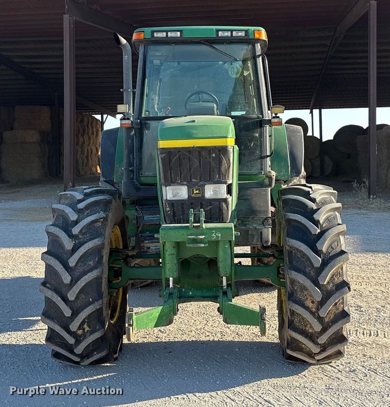 image for item EA7512 1997 John Deere 7810 MFWD tractor