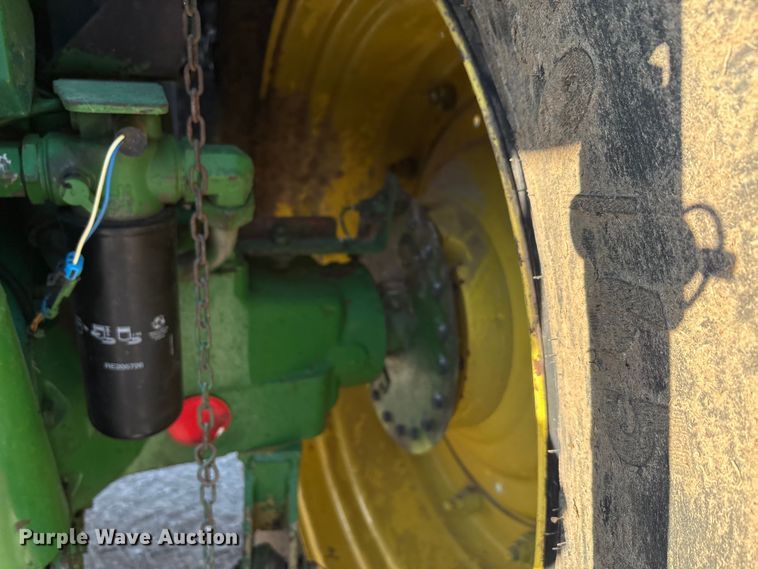 image for item EA7512 1997 John Deere 7810 MFWD tractor