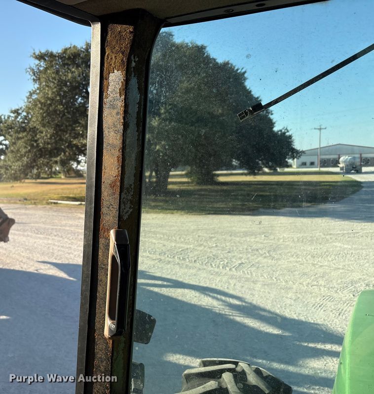 image for item EA7512 1997 John Deere 7810 MFWD tractor