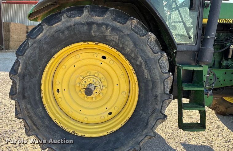 image for item EA7512 1997 John Deere 7810 MFWD tractor