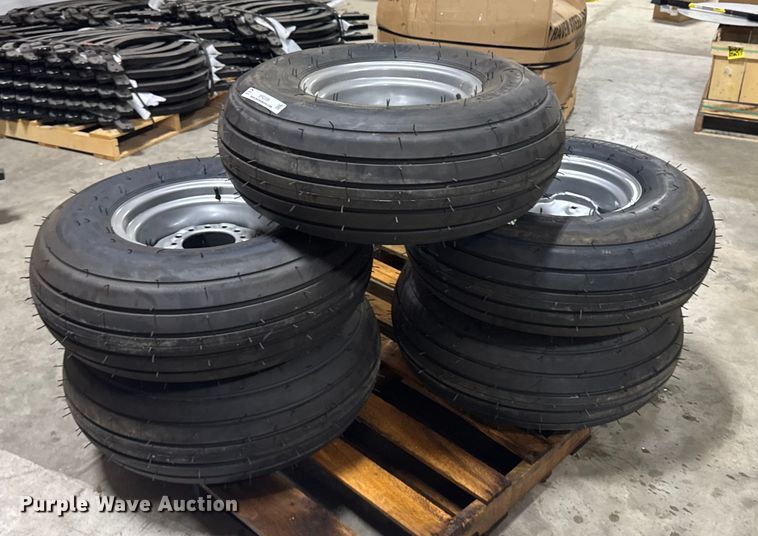 image for item ER2359 (21) 11L-14SL tires and rims