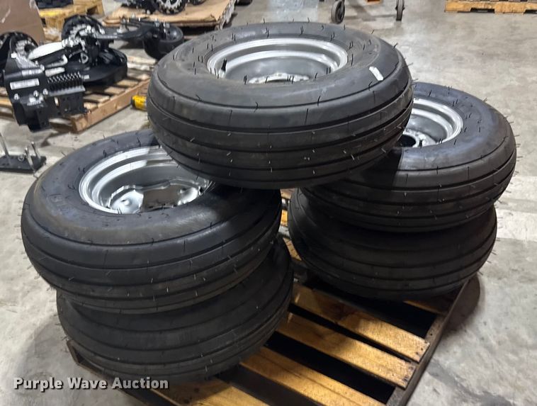 image for item ER2359 (21) 11L-14SL tires and rims
