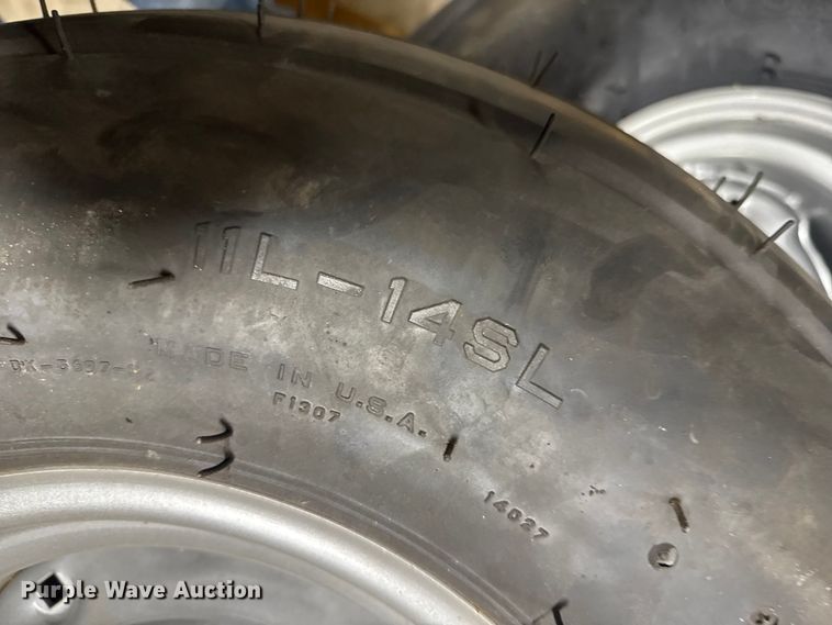 image for item ER2359 (21) 11L-14SL tires and rims