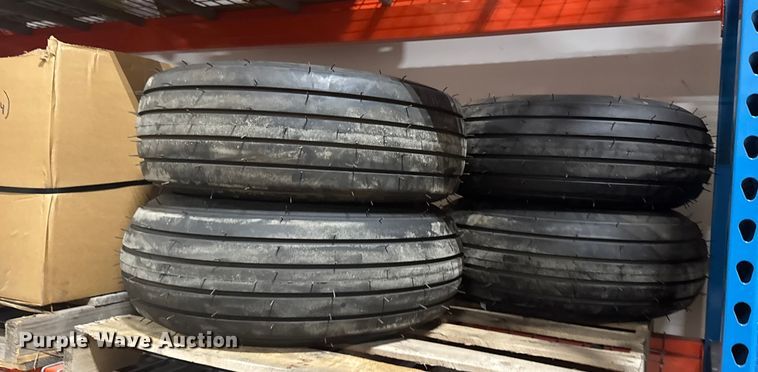 image for item ER2359 (21) 11L-14SL tires and rims