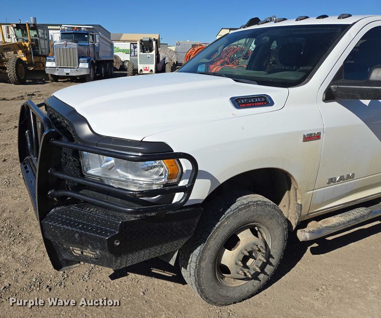 image for item DY1240 2019 RAM 3500HD Crew Cab flatbed pickup truck