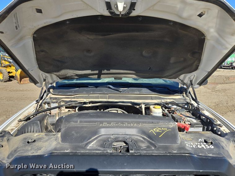 image for item DY1240 2019 RAM 3500HD Crew Cab flatbed pickup truck