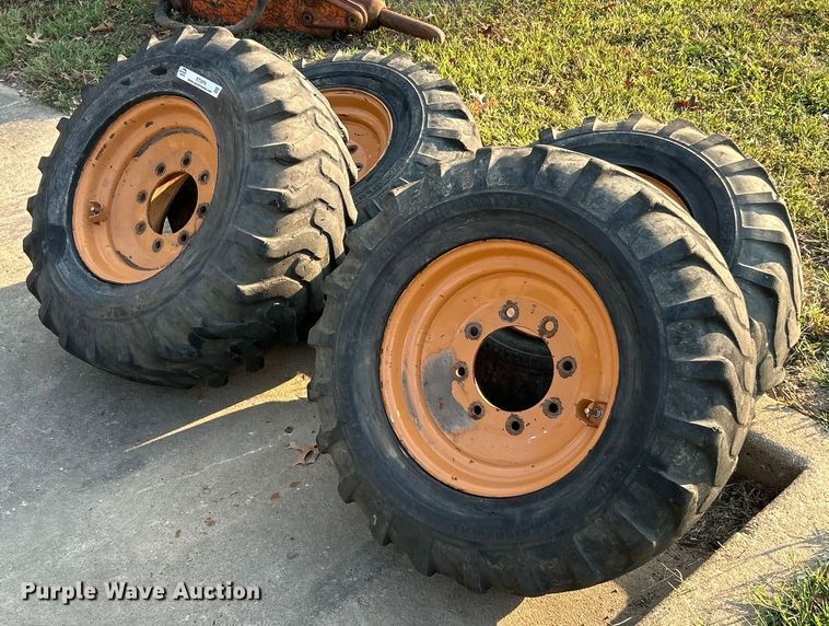 image for item ET3276 (4) 12-16.5L skid steer tires and wheels