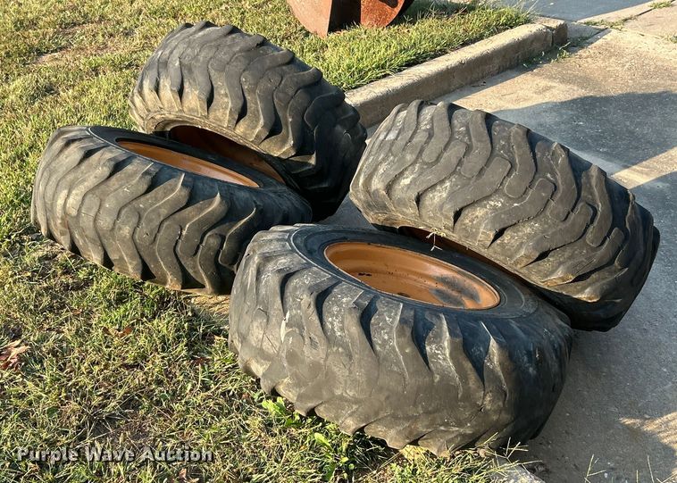 image for item ET3276 (4) 12-16.5L skid steer tires and wheels